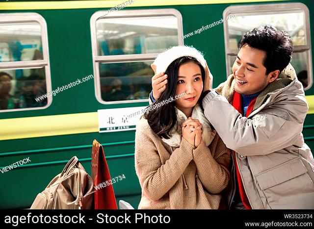 The stage of young couples at the railway station