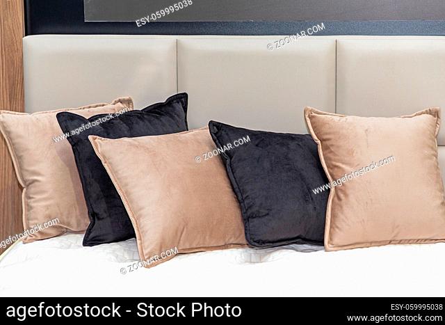 Docorative Plush Pillows and Cushions in Bed