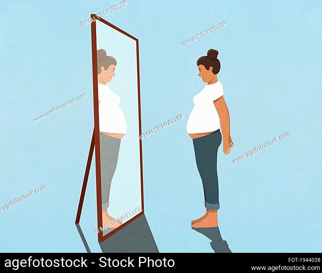 Woman looking at large stomach in mirror