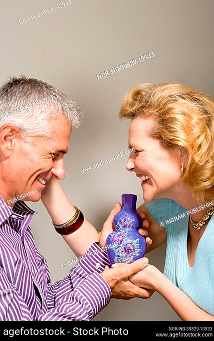 Affectionate couple with vase