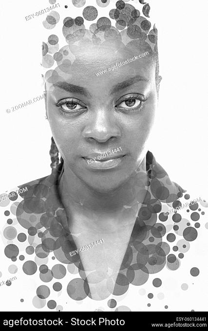 A full face double exposure portrait of an African American woman combined with digital art. Countless circles