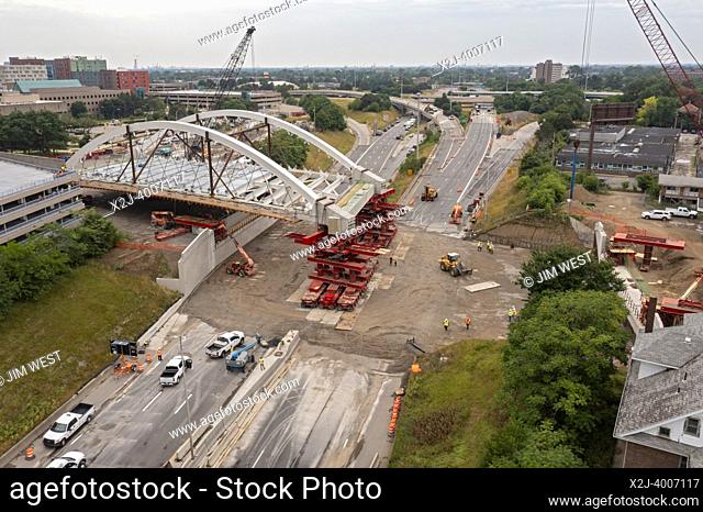 Detroit, Michigan USA - 24 July 2022 - The new Second Avenue bridge is rolled into place across Interstate 94. The 5, 000