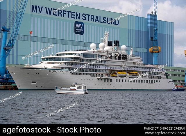 10 July 2021, Mecklenburg-Western Pomerania, Stralsund: The expedition cruise ship ""Crystal Endeavor"" built in Stralsund lies at the shipyard's fitting-out...