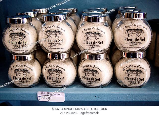 Fleur de sel old glass jars lined up and piled up for retail in a specialty store in Guerande, France
