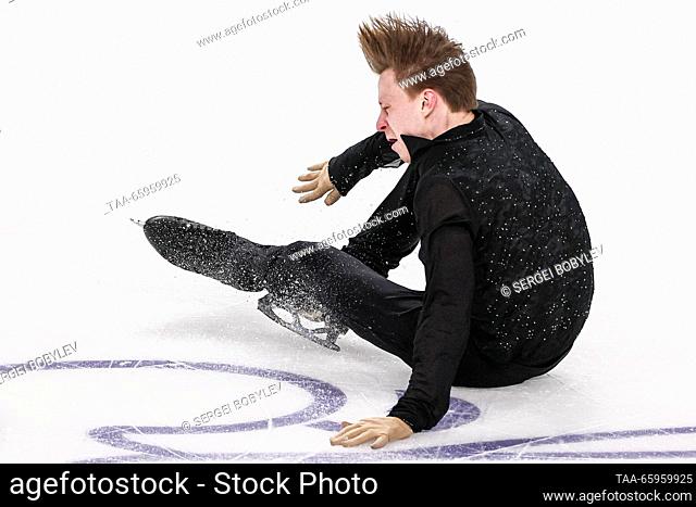 RUSSIA, CHELYABINSK - DECEMBER 21, 2023: Figure skater Alexei Yerokhov falls while performing his men's short programme during the 2024 Russian Figure Skating...