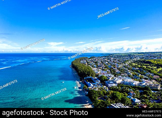Mauritius, Black River, Flic-en-Flac, Aerial view of blue summer sky over coastal town