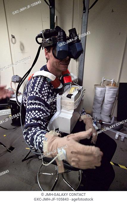 European Space Agency (ESA) astronaut Christer Fuglesang, STS-116 mission specialist, uses virtual reality hardware in the Space Vehicle Mockup Facility at the...