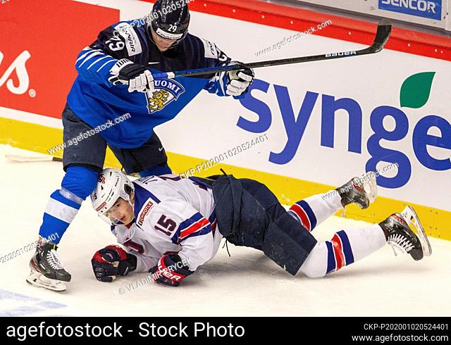 L-R Kim Nousiainen (FIN) and Alex Turcotte (USA) in action during the 2020 IIHF World Junior Ice Hockey Championships quarterfinal match between USA and Finland...