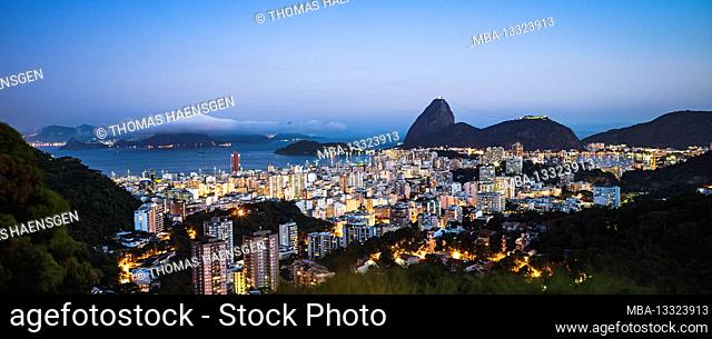 Long exposure panorama shot from the skyline of Botafogo with the Sugarloaf Mountain behind in Rio de Janeiro, Brazil in the evening during sunset