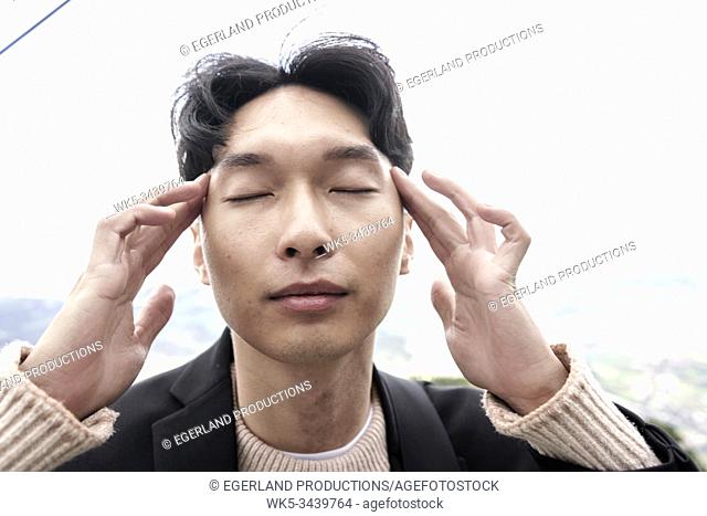 Korean man concentrating