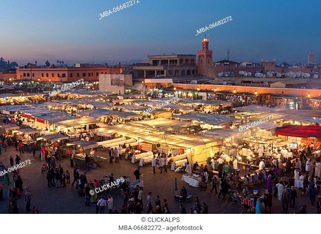 Jemaa el Fna, Marrakech, Morocco, North Africa. Evening stalls at sunset