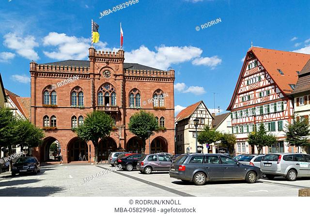 Germany, Baden-Wurttemberg, Tauberbischofsheim, city hall in the neo-Gothic style built in 1865, 'Marktplatz', old post, half-timbered house from the 16