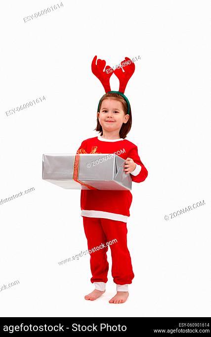 Cute kid in santa costume holding present