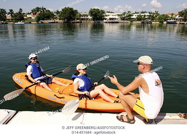 Indian Creek, Rowing Club, instructor, mother, son, rental kayak. Miami Beach. Florida. USA