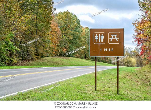 restrooms and picnic sign along Natchez Trace Parkway in Tennessee, fall colors in late October