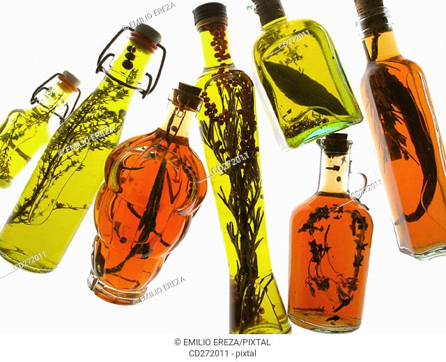 Oil olive and vinegars with aromatic herbs