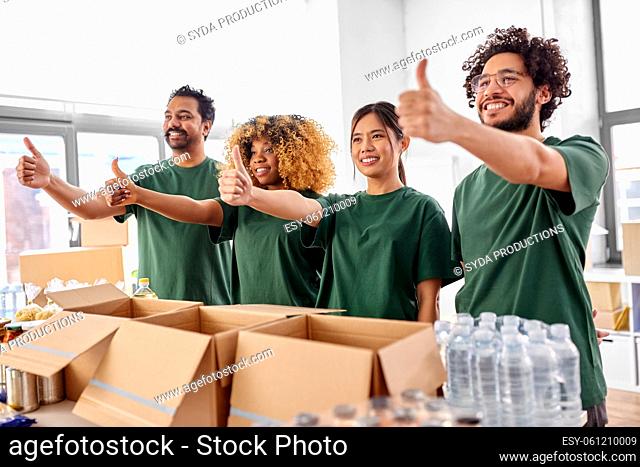 volunteers with food donation showing thumbs up