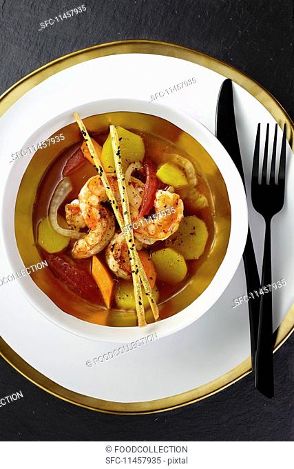 Clear prawn soup with tomatoes, fennel seeds and lemongrass