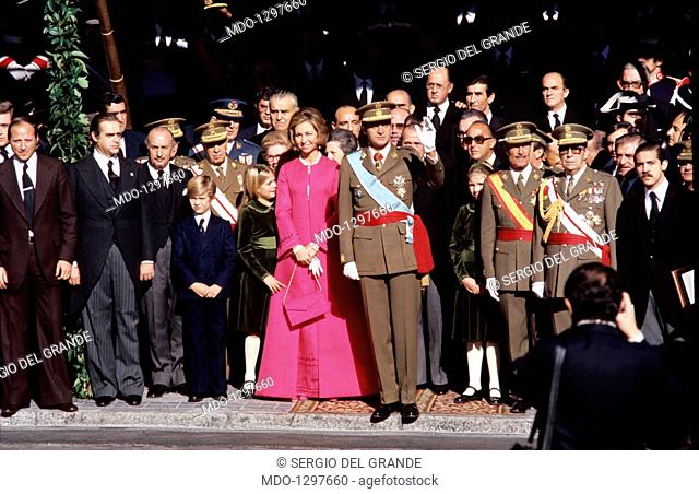 Juan Carlos I is greeting as new King of Spain, with Sofia of Greece and their children. Juan Carlos of Bourbon has just left the Palace of Cortes (the Spanish...