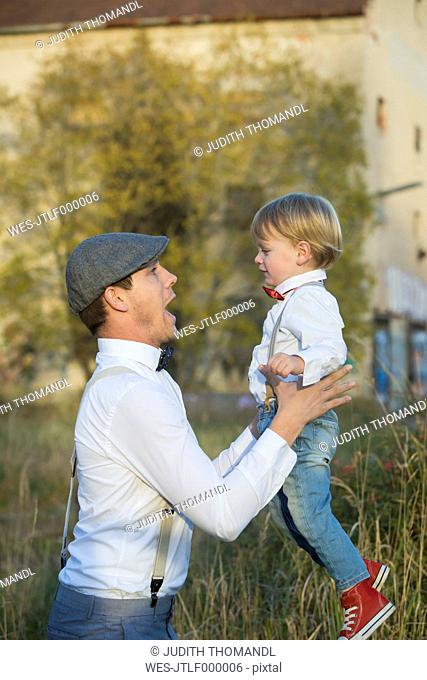 Happy father and son outdoors
