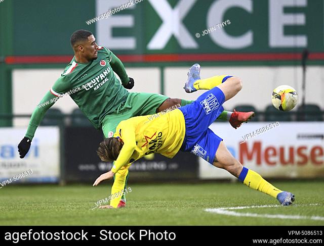Virton's Nicholas Rizzo and Waasland-Beveren's Daniel Maderner fight for the ball during a soccer match between RE Virton and Waasland Beveren