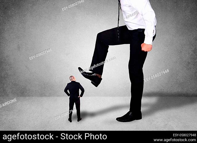 Composite image, bad leadership conflict concept. Big boss trying to stomping step on his small worker