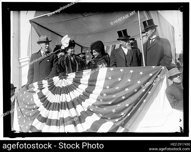 Woodrow Wilson and wife Ellen with unidentified on viewing stand, between 1910 and 1914. Creator: Harris & Ewing
