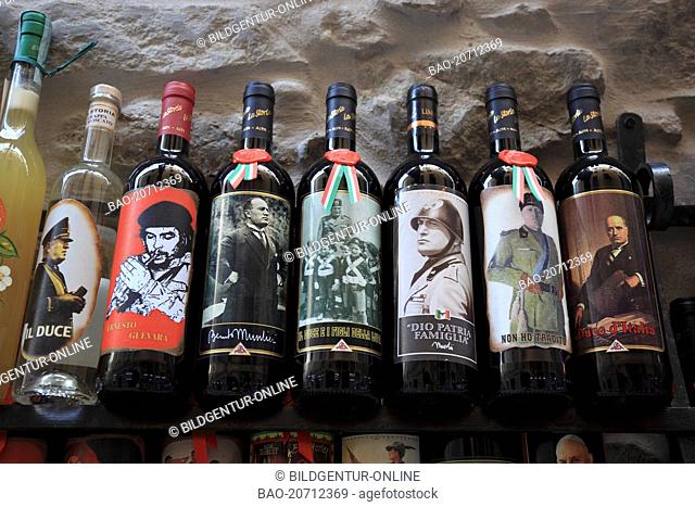 wine bottles with etiquettes of Duce Benito Mussoline, Ernesto Che Guevara - seen in the display of a wine action in Vernazza, Cinque Terre, Liguria, Italy