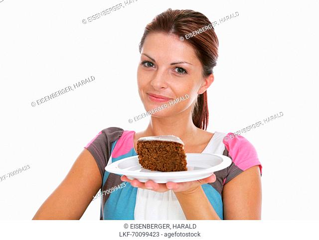 Mid adult woman holding a plate with chocolate cake, Styria, Austria