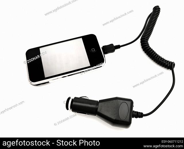 Mobile Phone With Car Adapter Against The White Background