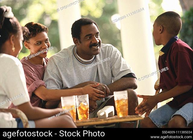 African family sitting on porch