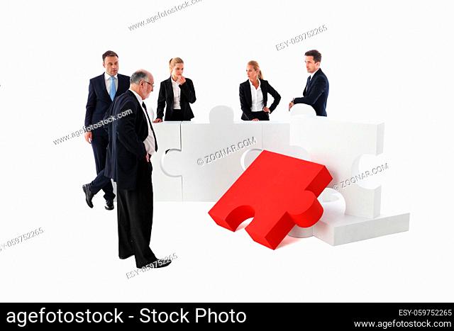 Business people team and jigsaw puzzle isolated on white background