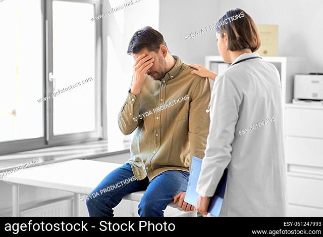doctor and sad man with health problem at hospital