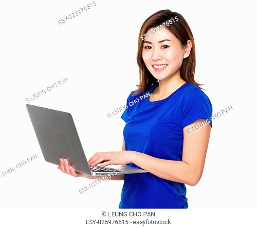 Asian young woman use of the laptop computer