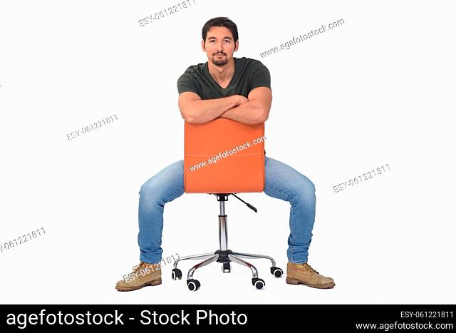 man sitting on a chair that is turned on white background