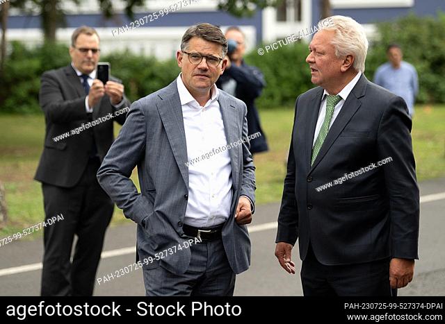25 July 2023, Hesse, Kassel: Boris Rhein (CDU, l), Minister President of Hesse, and Armin Papperger, CEO of Rheinmetall AG