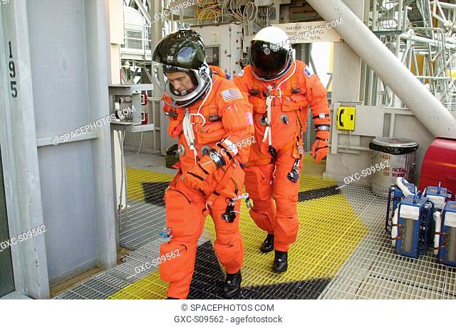 05/17/2002 -- On Launch Pad 39A, STS-111 Mission Specialists Franklin Chang-Diaz and Philippe Perrin practice making a hasty exit from the 195-foot level to the...