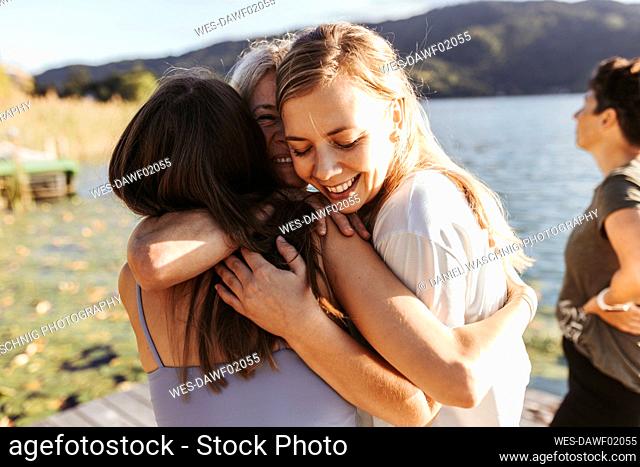 Female friends embracing each other after yoga class