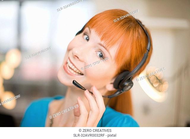 Smiling woman wearing headset