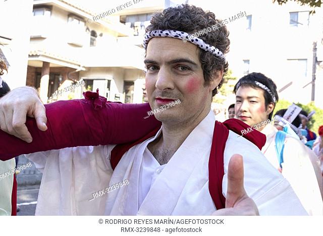 February 24, 2019, Tokyo, Japan - A foreigner from Australia dressed in women's kimonos and wearing makeup, takes part during the Ikazuchi no Daihannya festival
