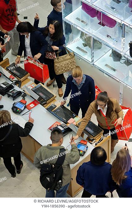 Shoppers in the Macy's Herald Square flagship store in New York looking for bargains on Black Friday, the day after Thanksgiving Many retailers opened their...