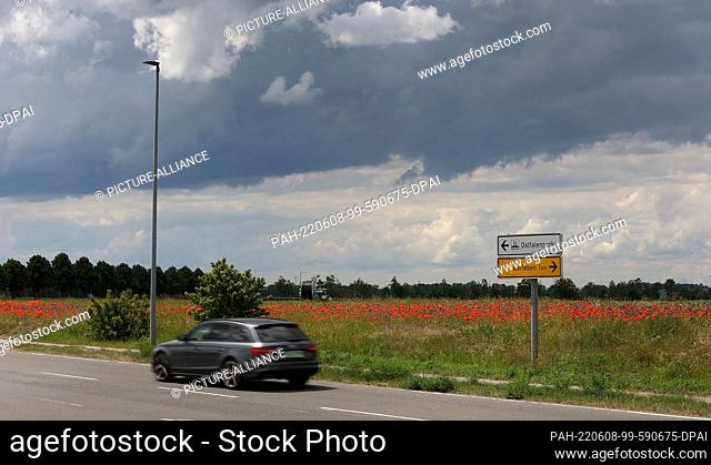 08 June 2022, Saxony-Anhalt, Barleben: A sign stands in Barleben in front of the site where the new building for the Saxony-Anhalt State Criminal Police Office...
