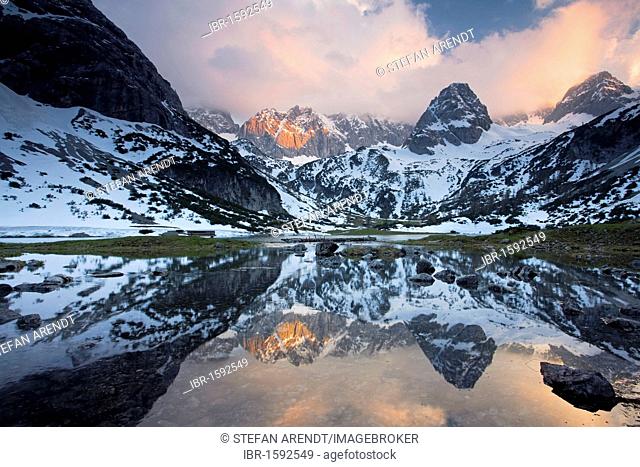 Lake Seebensee near Zugspitze Mountain with reflections in the evening light, Ehrwald, Austria, Europe