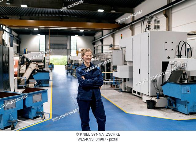 Young woman working as a skilled worker in a high tech company, portrait