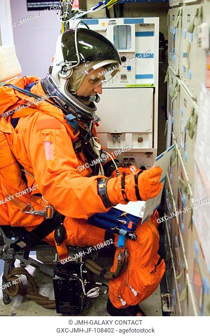Astronaut Dafydd R. (Dave) Williams, STS-118 mission specialist representing the Canadian Space Agency, attired in his training version of the shuttle launch...