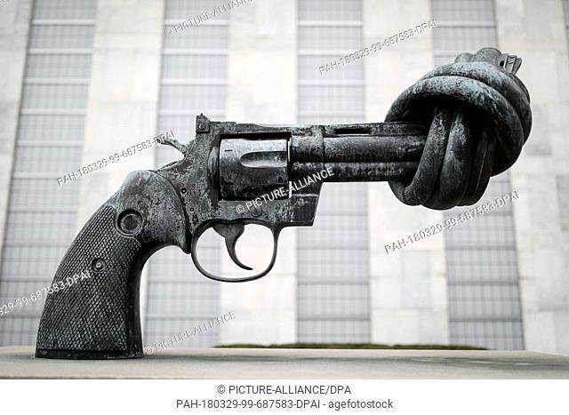28 March 2018, US, New York: The art piece ""Non Violence"" by Carl Frederik Reuterswaerd pictured in front of the UN headquarters
