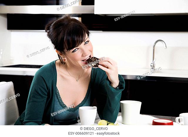 home life: woman eating a piece of cake