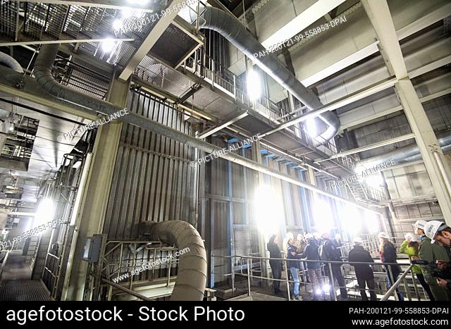 16 January 2020, Lower Saxony, Hohenhameln: A group of visitors is standing in the Mehrum coal-fired power station in the district of Peine