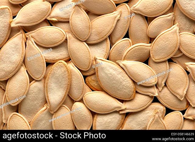 Background from pumpkin seeds. Healthy food