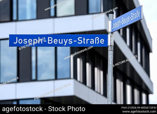 PRODUCTION - 03 May 2021, Hessen, Kassel: The street sign ""Joseph-Beuys-Straße"" is located in the city centre. The ""7000 Oaks"" campaign by artist Joseph...